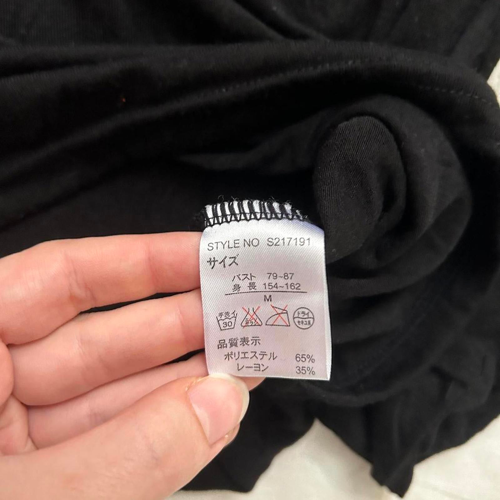 Axes Femme Black long sleeve turtleneck top with floral bib embroidery