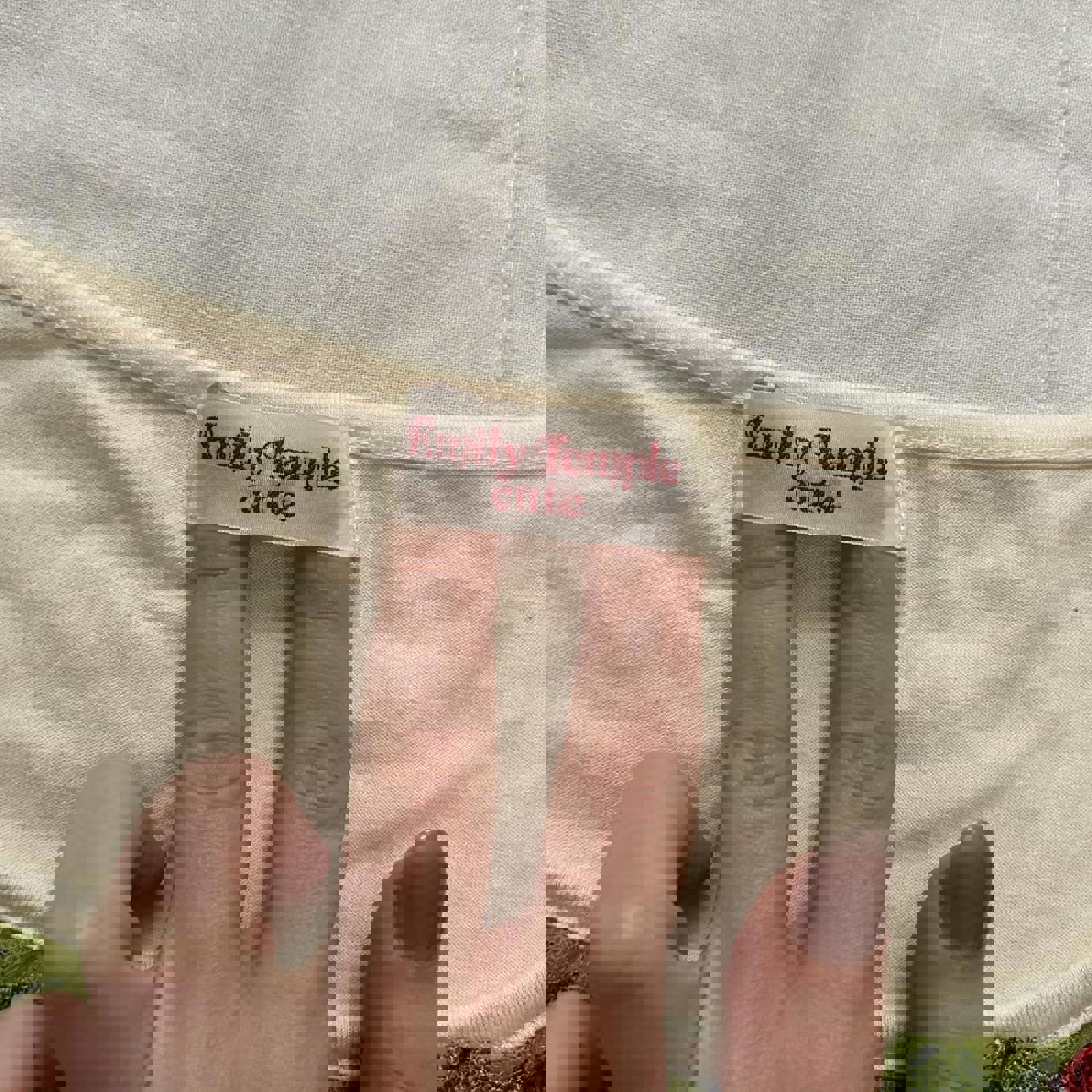 Emily Temple Cute Cream and green lace trim top with red charm detail