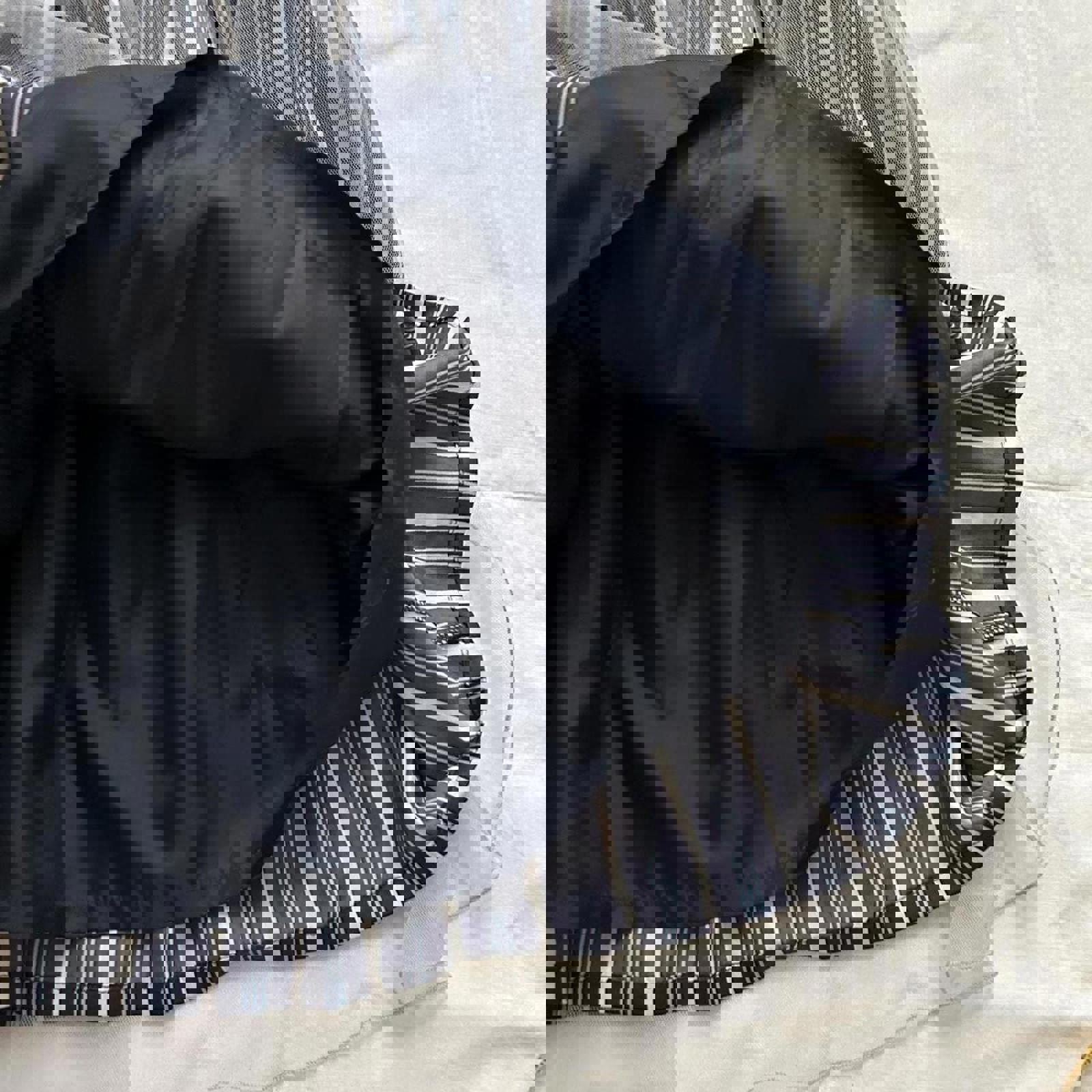 Axes Femme navy and white striped skirt with tulle overlay and elastic waistband