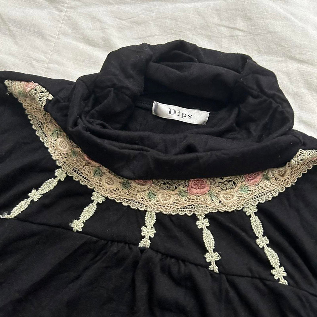 Axes Femme Black long sleeve turtleneck top with floral bib embroidery
