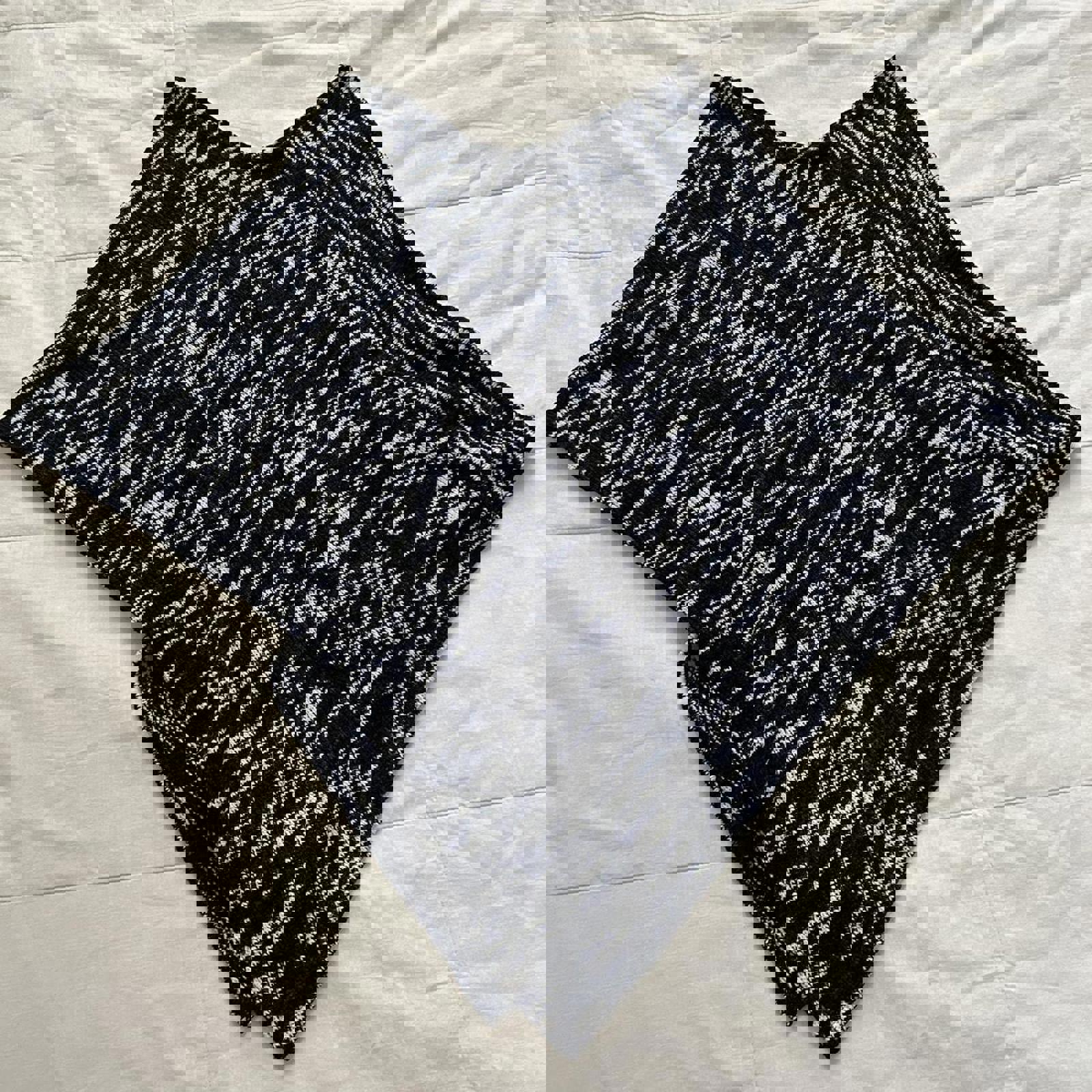 Black and white space dyed yarn knit poncho with a boho vibe